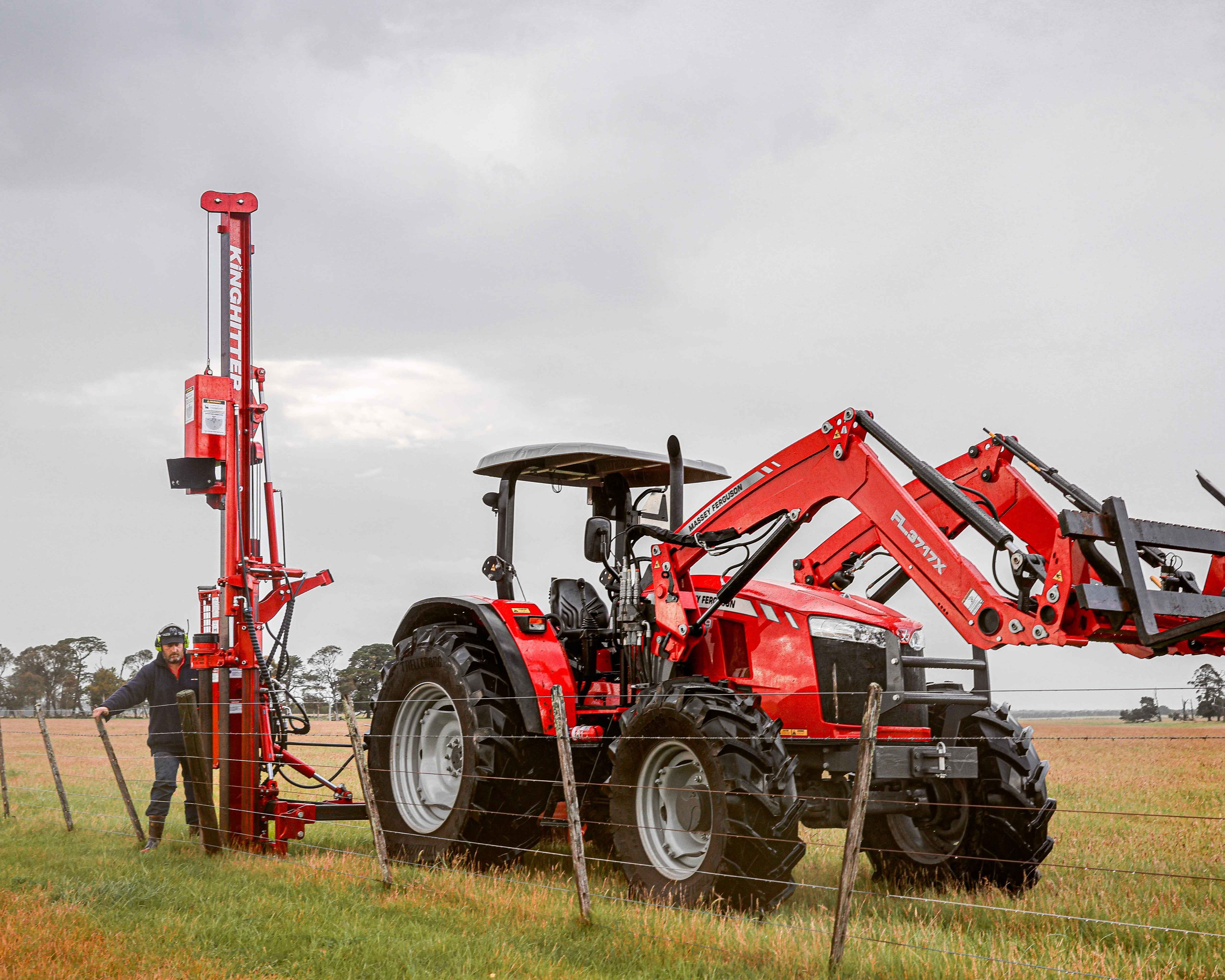 Post rammer operated by farmer in New Zealand paddock